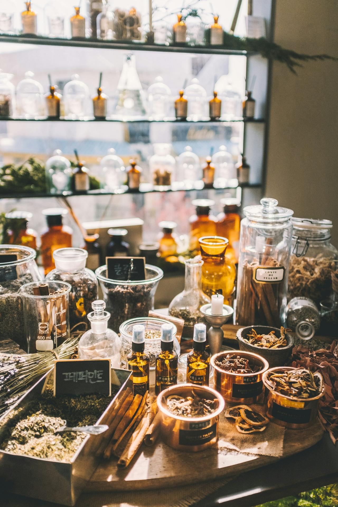 Wooden apothecary table with jars and herbs